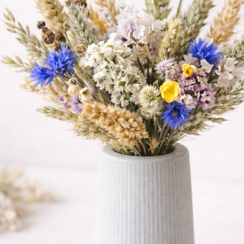 concrete vase with dried flowers detail