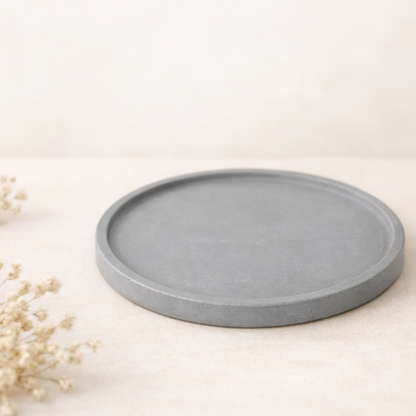 kulaty podtacek tmave sedy na svetlem pozadi